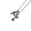 Petit collier avec croix et breloque Babyfat serti de diamants Petit collier avec croix et breloque Babyfat serti de diamants